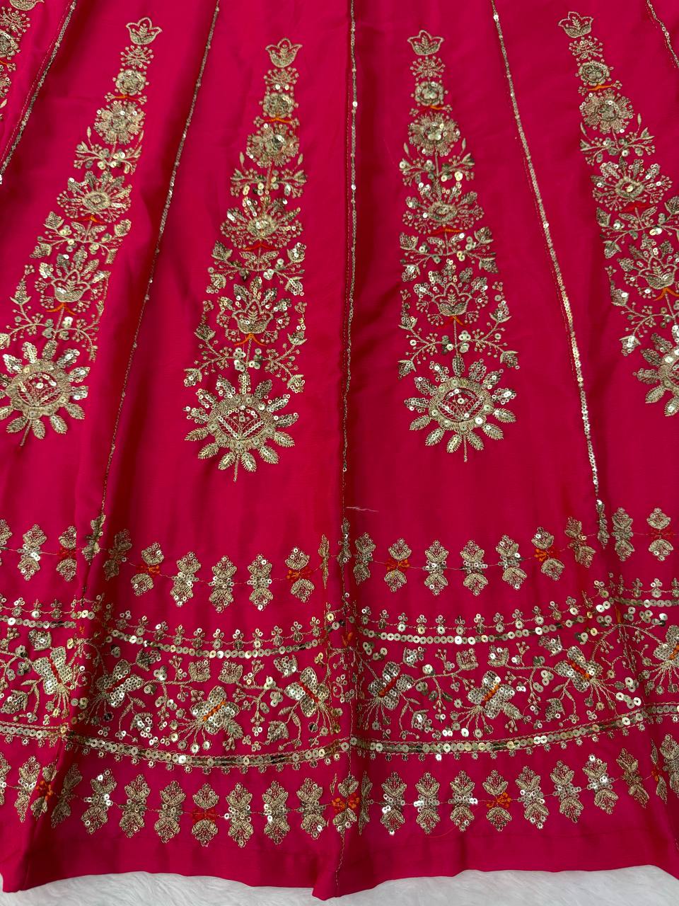 Radiant Rani Pink Silk Lehenga Choli Adorned with Opulent Heritage Floral Motifs and Intricate Zari Borders